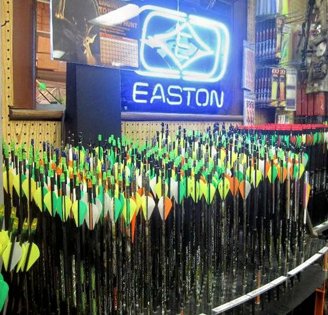 Racks of custom-fletched arrows in the shop